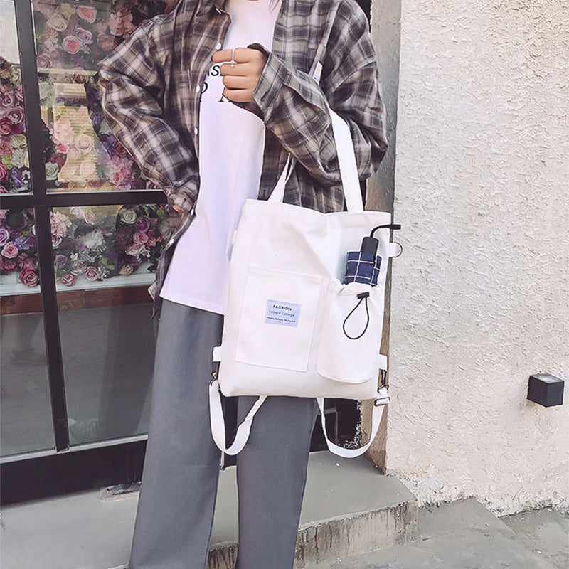Canvas tote bag worn as a backpack