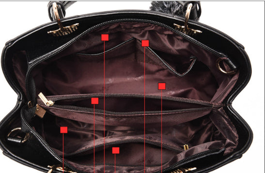 Colorblock handbag with pom-pom charm